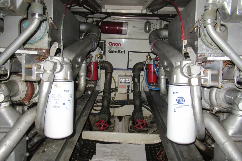 Slide: The Image of Engine room of 1990 Viking 38 Convertible with Onan Marine GenSet and NAPA filters. - 42