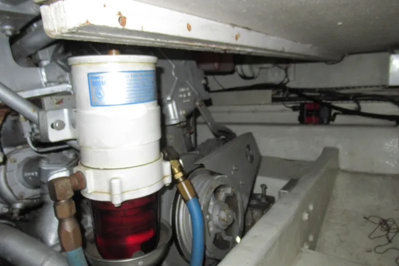 Slide: The Image of Engine room of a 1990 Viking 38 Convertible boat, showcasing mechanical components. - 43