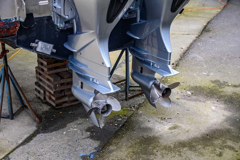 Slide: The Image of Twin outboard motors on a 2004 SAFE Boats Defender, displayed on a stand. - 12