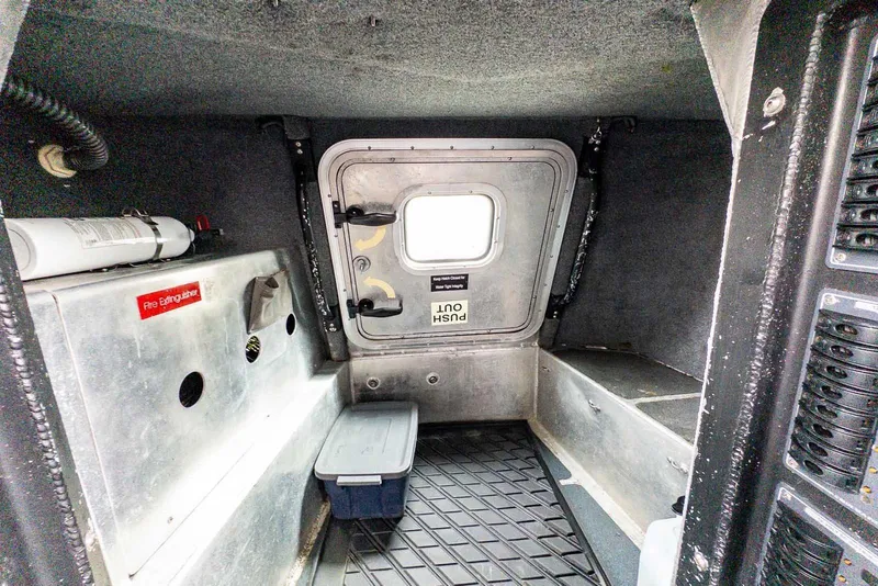 Slide: The Image of Control panel of a 2004 SAFE Boats Defender with Honda safety stop switch. - 20
