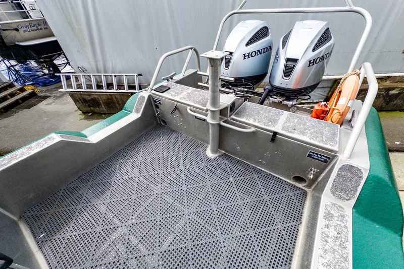 Slide: The Image of 2004 SAFE Boats Defender with dual Honda engines, docked with safety equipment visible. - 8