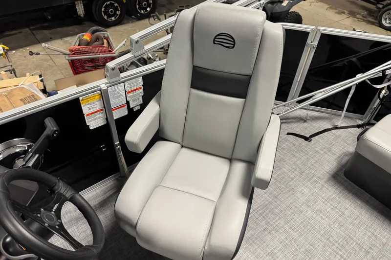 Slide: The Image of Captain's chair on 2026 Sun Tracker Party Barge 20 DLX pontoon boat, featuring sleek design. - 10