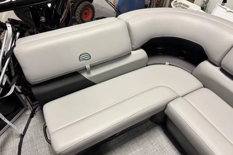 Slide: The Image of 2026 Sun Tracker Party Barge 20 DLX interior seating, featuring plush gray upholstery. - 11