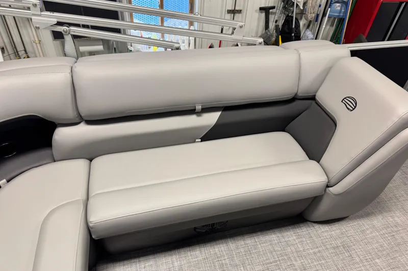 Slide: The Image of 2026 Sun Tracker Party Barge 20 DLX interior seating with gray upholstery. - 12