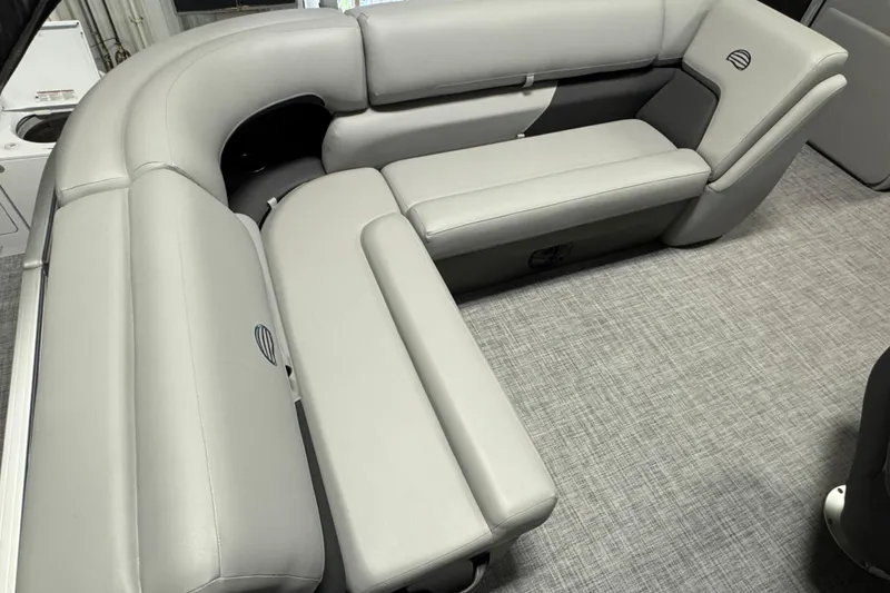 Slide: The Image of 2026 Sun Tracker Party Barge 20 DLX interior with gray cushioned seating and modern design. - 15