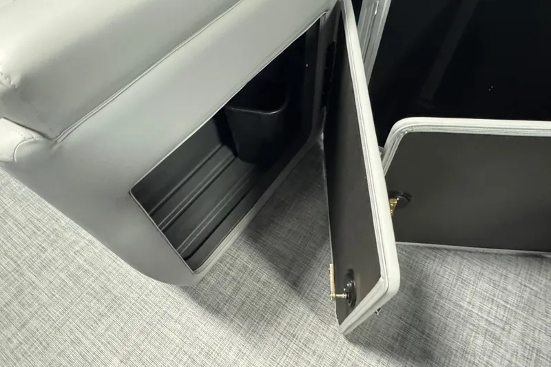 Slide: The Image of Open storage compartment on 2026 Sun Tracker Party Barge 20 DLX pontoon boat. - 17