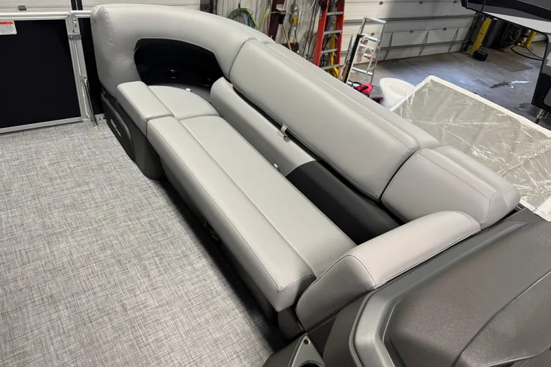 Slide: The Image of 2026 Sun Tracker Party Barge 20 DLX interior with sleek gray seating and modern design. - 5