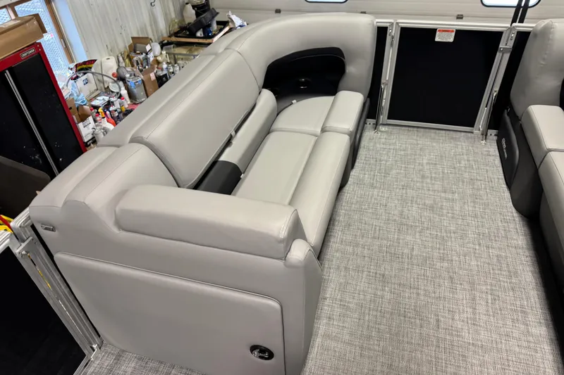 Slide: The Image of Interior of 2026 Sun Tracker Party Barge 20 DLX with gray seating and carpet. - 6