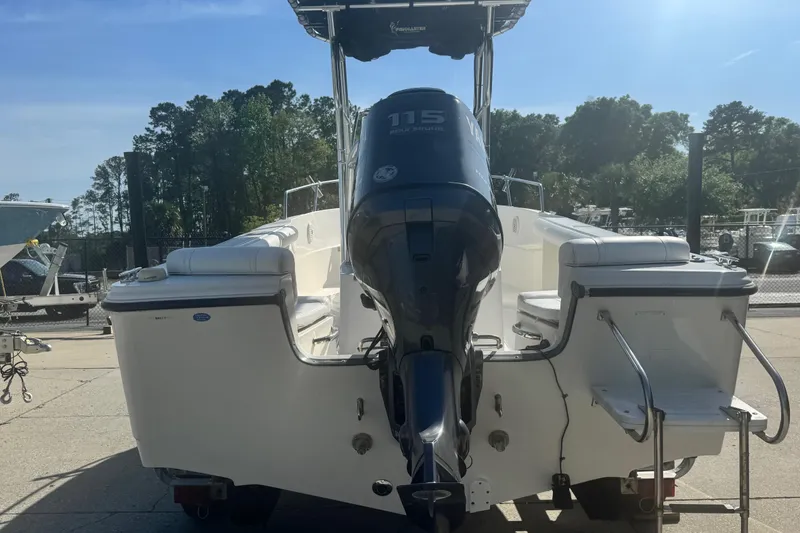 Slide: The Image of 2007 Edgewater 188CC boat with Yamaha 115 outboard motor, parked outdoors. - 11