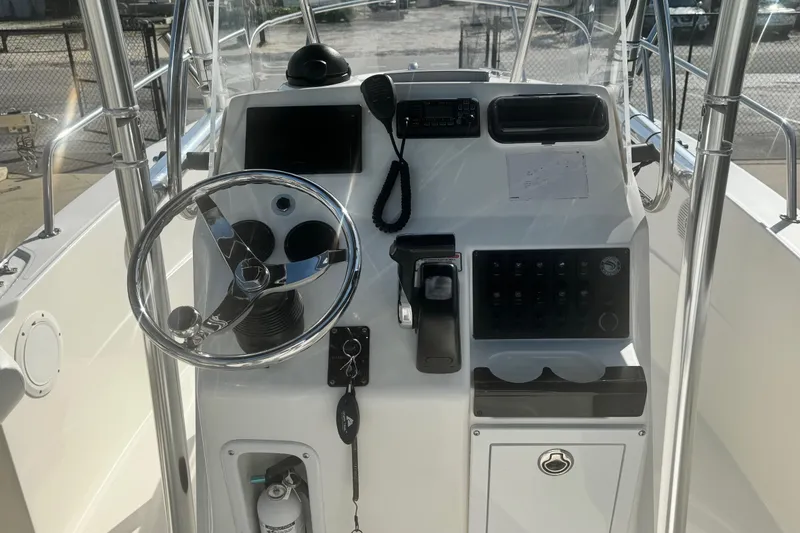 Slide: The Image of 2007 Edgewater 188CC boat console with steering wheel and control panel. - 4