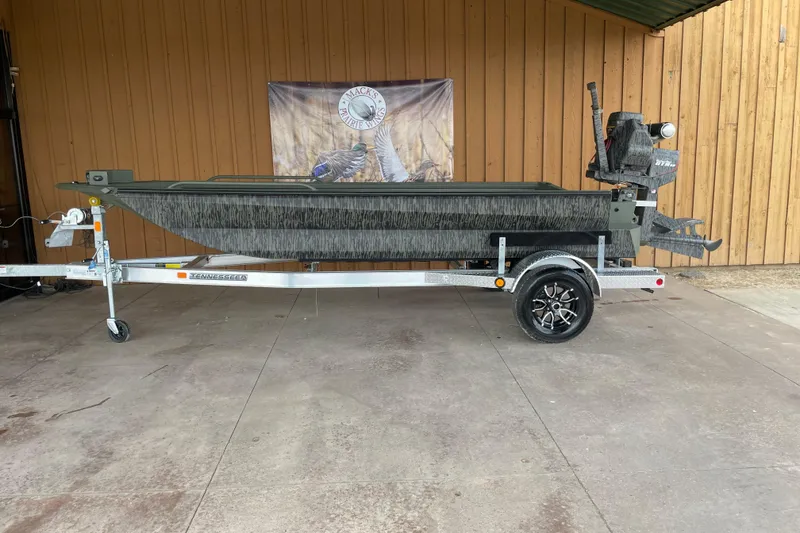 Slide: The Image of 2026 Reaper Boats 753 Timber Reaper on trailer, displayed outdoors. - 12