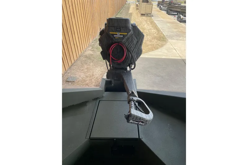 Slide: The Image of 2026 Reaper Boats 753 Timber Reaper with GatorTail motor, parked outdoors. - 16