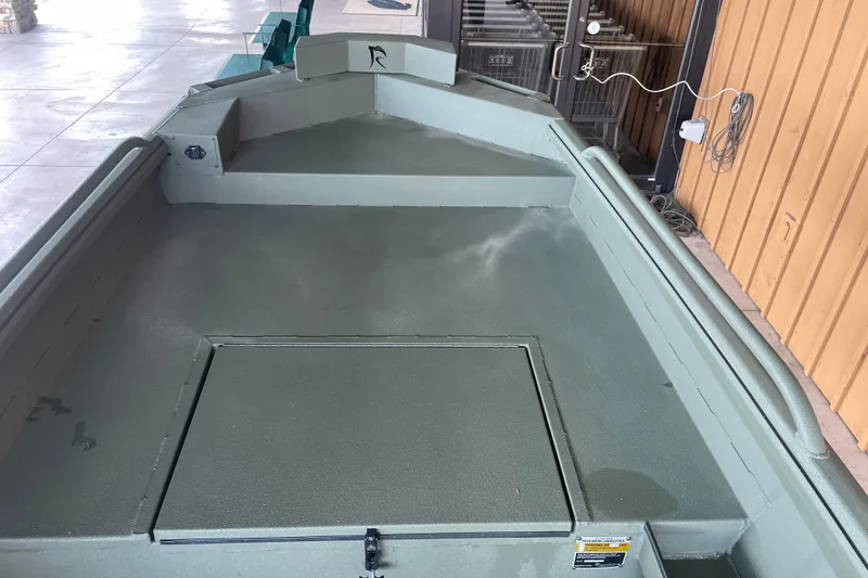 Slide: The Image of 2026 Reaper Boats 753 Timber Reaper interior, showcasing spacious deck and storage compartment. - 17