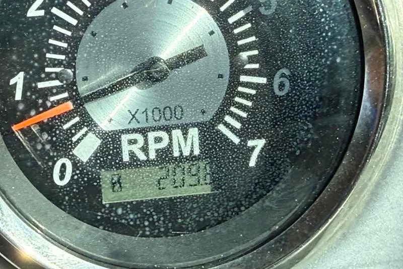 Slide: The Image of Close-up of 2017 NauticStar 243DC Sport Deck RPM gauge displaying 2090 RPM. - 14
