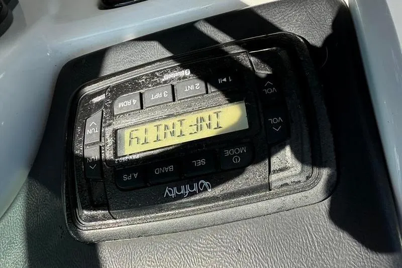 Slide: The Image of Control panel of a 2017 NauticStar 243DC Sport Deck boat. - 19