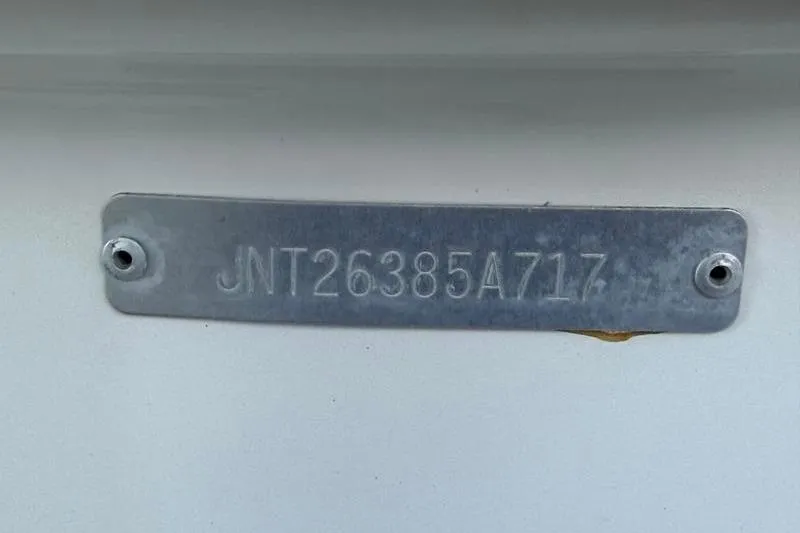 Slide: The Image of Hull identification number on 2017 NauticStar 243DC Sport Deck boat. - 27