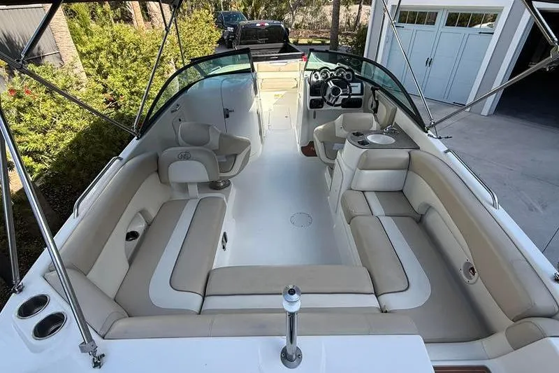 Slide: The Image of 2017 NauticStar 243DC Sport Deck boat with spacious seating and modern dashboard. - 6