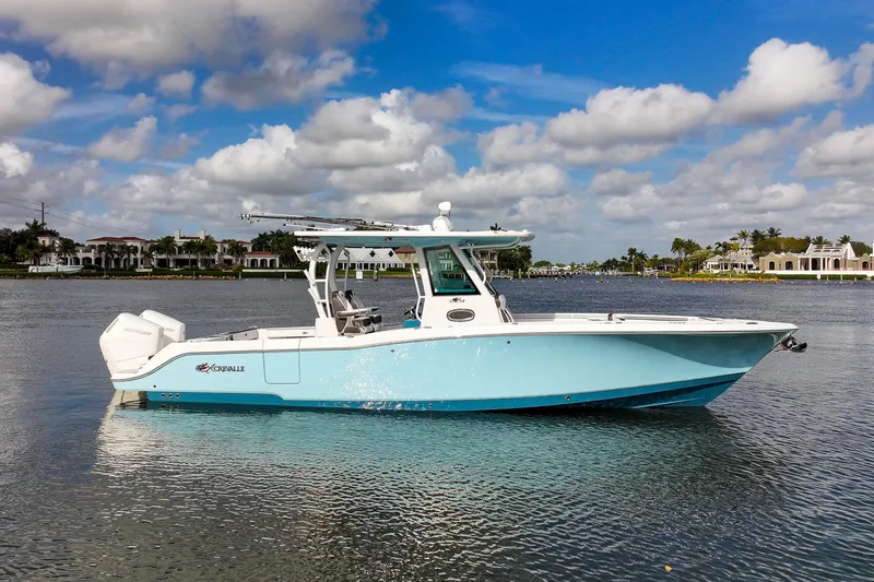 The Image of 2024 Crevalle 33 CSF boat on calm water under a partly cloudy sky. - 0
