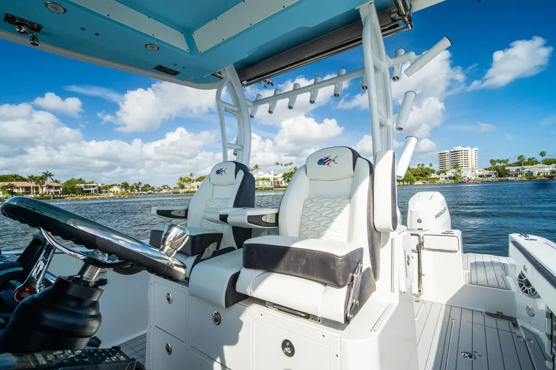Slide: The Image of 2024 Crevalle 33 CSF boat interior with luxurious seating and scenic waterfront view. - 14