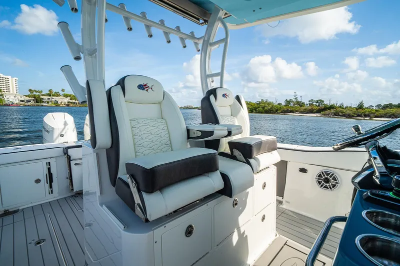 Slide: The Image of 2024 Crevalle 33 CSF boat interior with luxurious seating and scenic water view. - 15
