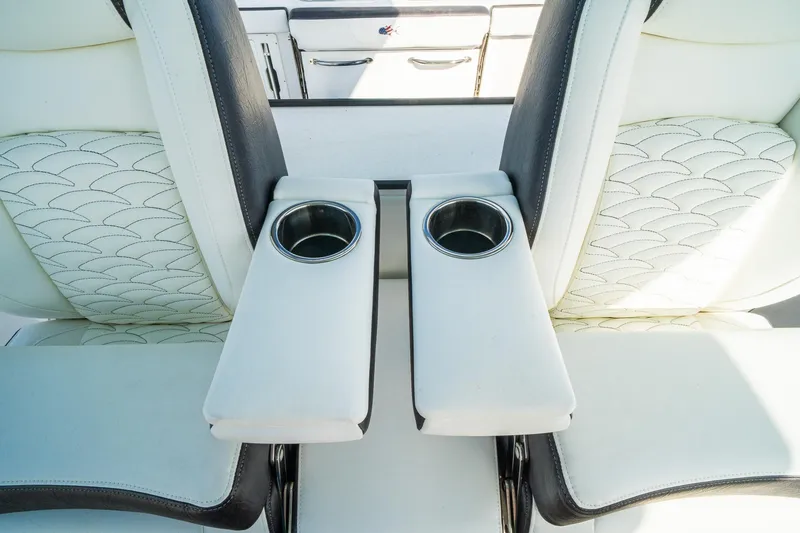 Slide: The Image of 2024 Crevalle 33 CSF boat seats with cup holders, featuring elegant stitching design. - 16