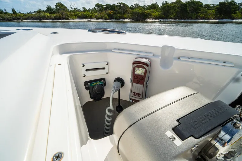 Slide: The Image of 2024 Crevalle 33 CSF boat interior with control panel and equipment by the water. - 18