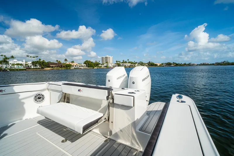 Slide: The Image of 2024 Crevalle 33 CSF boat with dual Mercury engines on a sunny day. - 22