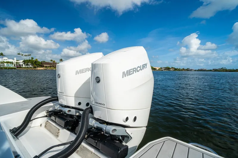 Slide: The Image of 2024 Crevalle 33 CSF boat with dual Mercury outboard engines on a sunny day. - 25