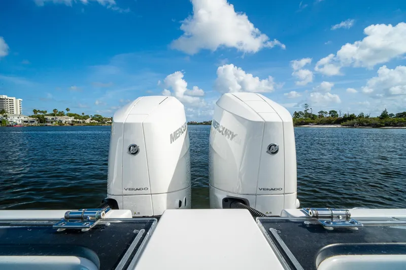 Slide: The Image of 2024 Crevalle 33 CSF boat with twin Mercury Verado engines on a sunny day. - 26