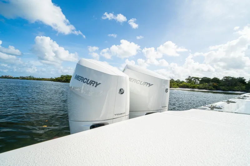 Slide: The Image of 2024 Crevalle 33 CSF boat with twin Mercury outboard engines on a sunny day. - 27