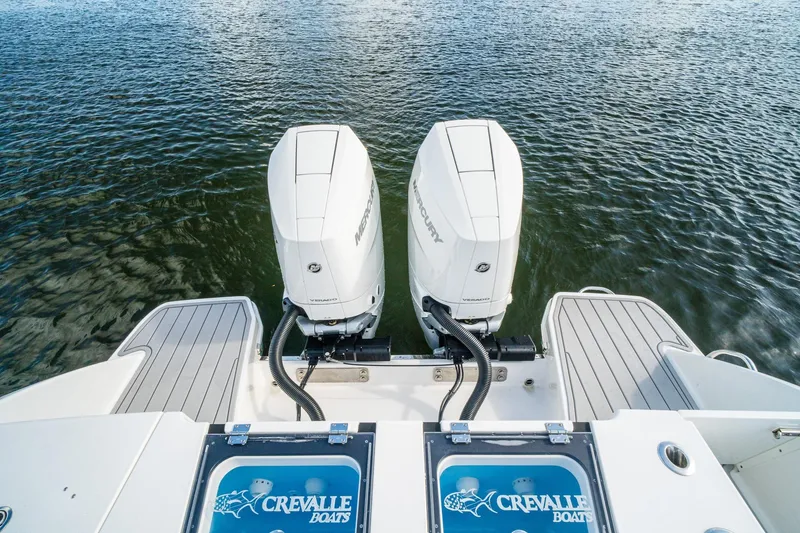 Slide: The Image of 2024 Crevalle 33 CSF boat with dual Mercury outboard engines on water. - 29