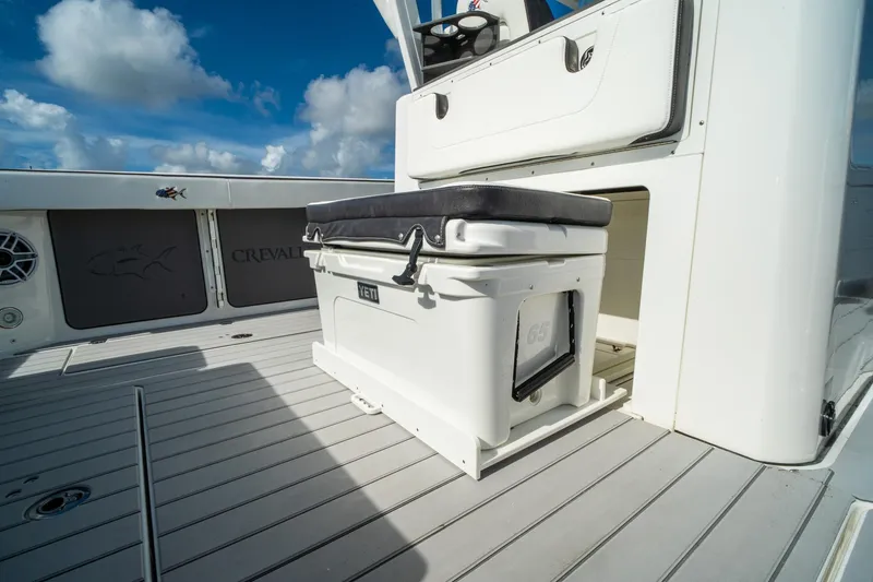 Slide: The Image of 2024 Crevalle 33 CSF boat deck with Yeti cooler and seating. - 35