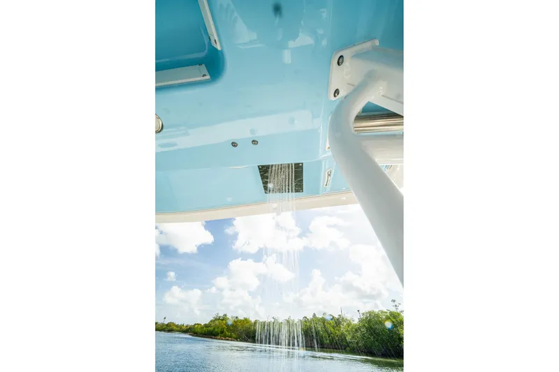 Slide: The Image of 2024 Crevalle 33 CSF boat shower feature with scenic water view. - 39