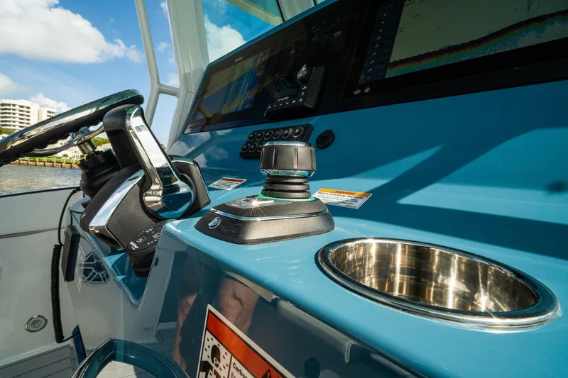 Slide: The Image of 2024 Crevalle 33 CSF boat helm with joystick control and navigation display. - 40