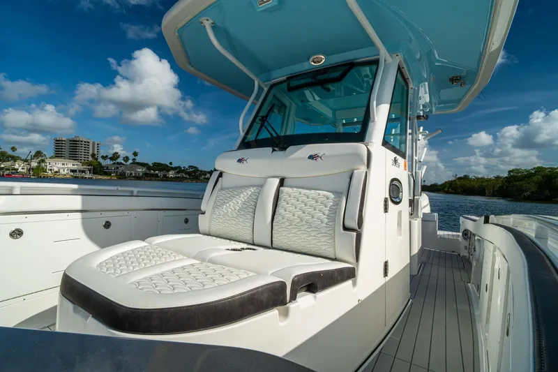 Slide: The Image of 2024 Crevalle 33 CSF boat with luxurious seating and sleek design on a sunny day. - 47