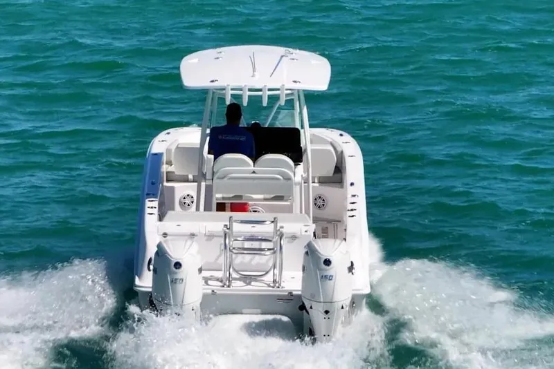 Slide: The Image of 2026 Twin Vee 240 GFX2 CC boat on open sea. - 2