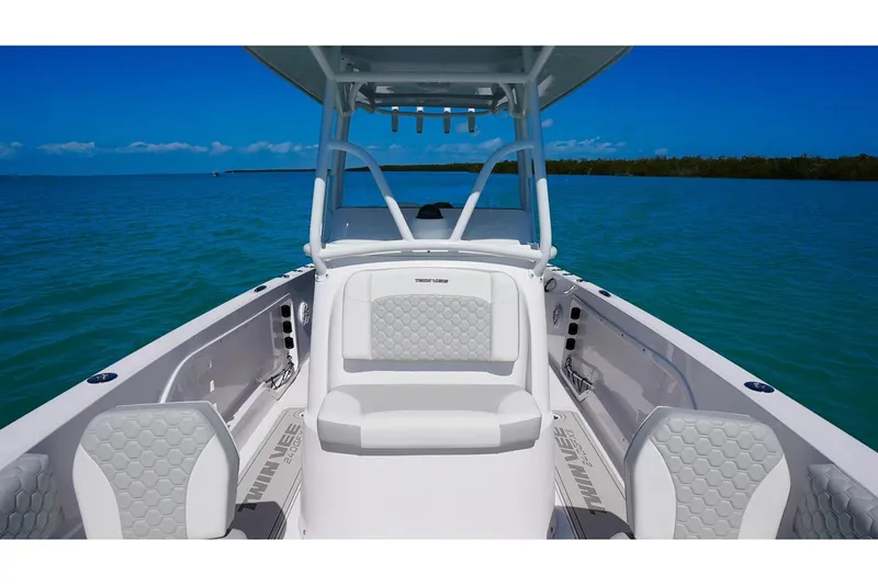 Slide: The Image of 2026 Twin Vee 240 GFX2 CC boat on calm waters. - 5