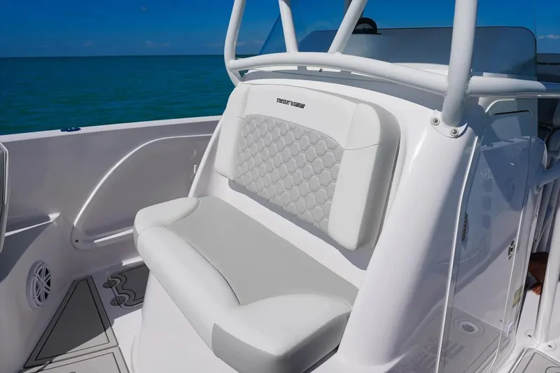 Slide: The Image of 2026 Twin Vee 240 GFX2 CC boat seat on open sea. - 6