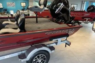 Slide: The Image of 2026 Crestliner XF 179 boat with Mercury engine on display in showroom. - 5
