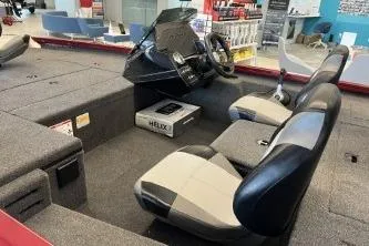 Slide: The Image of 2026 Crestliner XF 179 boat interior with dual seats and modern dashboard. - 7