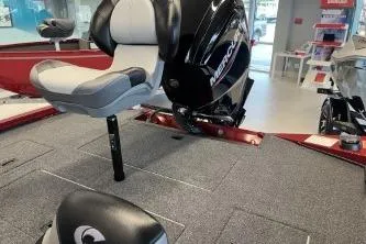 Slide: The Image of 2026 Crestliner XF 179 boat interior with Mercury engine, featuring comfortable seating and carpeted flooring. - 9