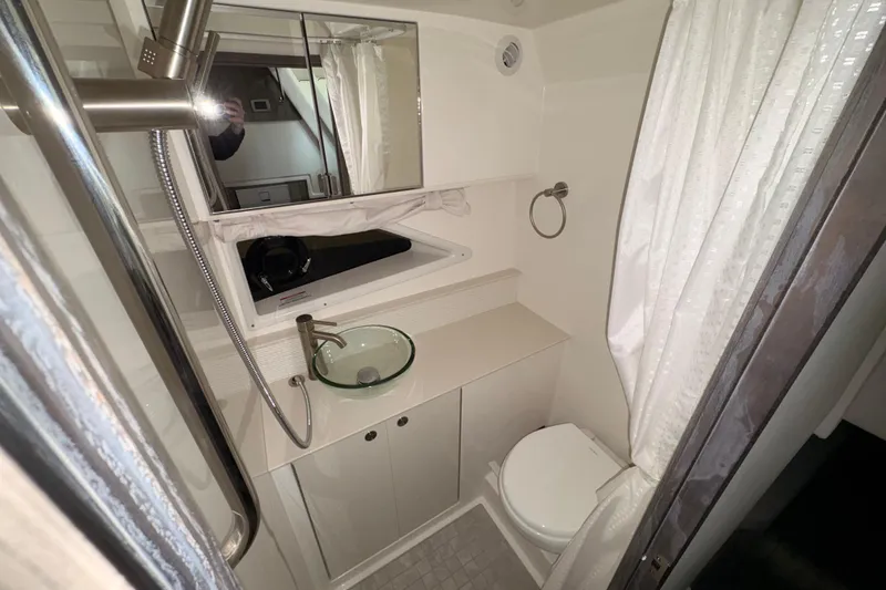 Slide: The Image of Modern bathroom in 2026 Sea Ray Sundancer 320 yacht with glass sink and shower. - 10