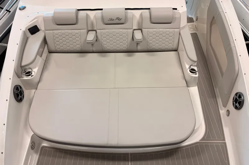 Slide: The Image of Luxurious seating area on 2026 Sea Ray Sundancer 320 boat, featuring elegant upholstery and cup holders. - 19