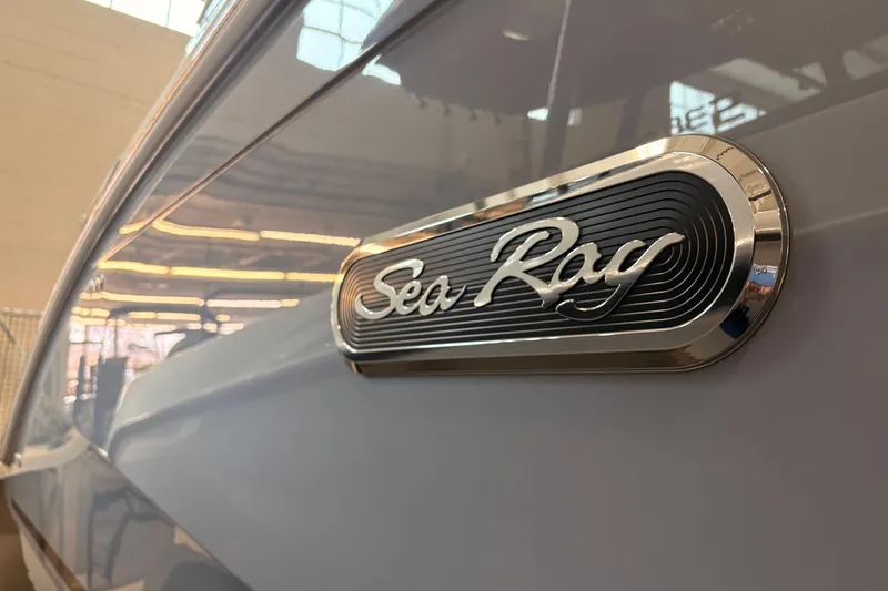 Slide: The Image of 2026 Sea Ray Sundancer 320 emblem on sleek boat exterior. - 4