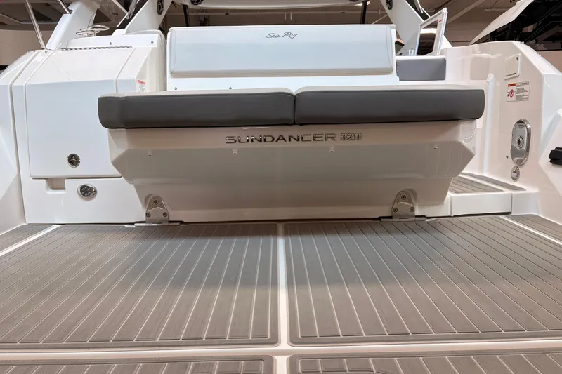 Slide: The Image of 2026 Sea Ray Sundancer 320 boat deck with seating and sleek design. - 7