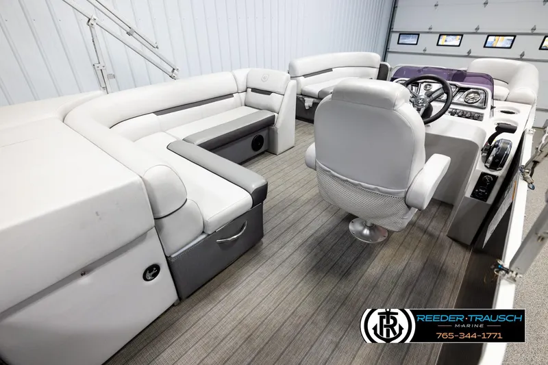Slide: The Image of Interior of a 2019 Sweetwater SW2086c pontoon boat with plush seating and modern controls. - 12