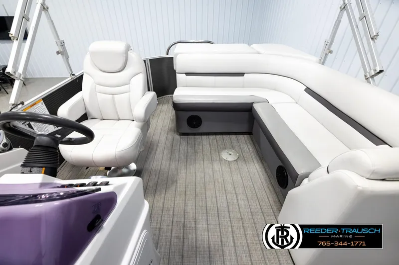 Slide: The Image of Interior of a 2019 Sweetwater SW2086c pontoon boat with white seating and steering wheel. - 14