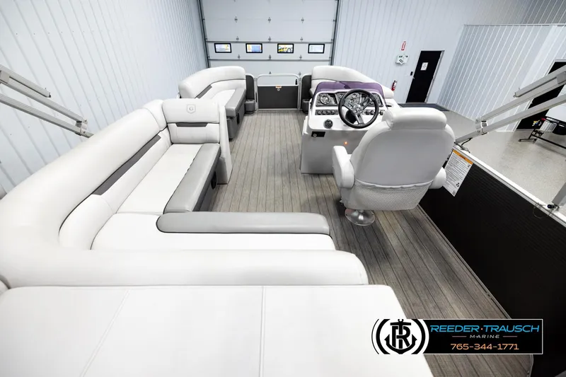 Slide: The Image of Luxurious 2019 Sweetwater SW2086c pontoon boat interior with plush seating and modern helm. - 16