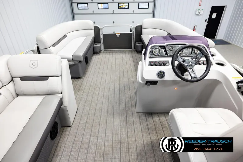 Slide: The Image of Interior of a 2019 Sweetwater SW2086c pontoon boat with plush seating and modern helm. - 17