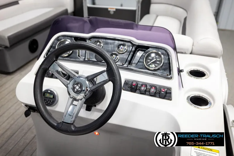 Slide: The Image of Steering console of 2019 Sweetwater SW2086c boat with gauges and controls. - 24
